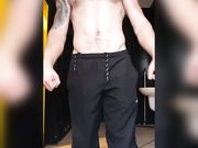 muscular guy tense up after the gym