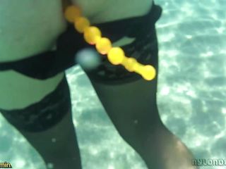 Black Stocking And Anal Beads In The Sea