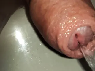 Extreme Close Up Of Uncutted Cock. Foreskin Play While Piss