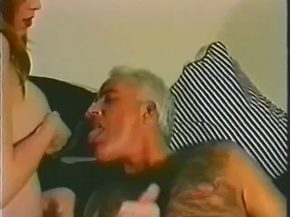 WOMAN BREASTFEEDS OLD MAN