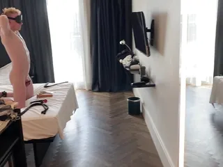 Locked Slave fucking itself in a hotel room