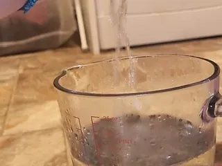 Jug Measuring Piss video: Pissing into a jug.