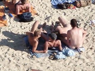 Group Of Guys Having Sex On The Beach