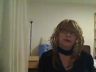 Horny Milf Tranny In Front Of The Camera Simulates A Blowjob While Playing With A Vibrator