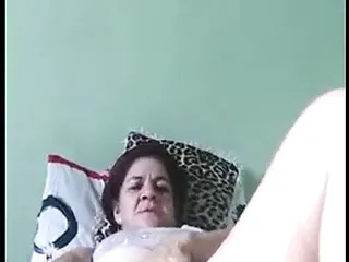 Brazilian mature playing with her dildo