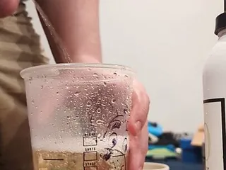 Bear Cub Almost filling a Starbucks Trenta cup with piss